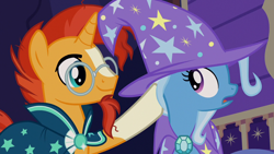 Size: 1280x720 | Tagged: safe, derpibooru import, screencap, sunburst, trixie, uncommon bond, clothes, duo, hat, magic trick, trixie's hat, trixie's wagon