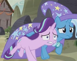 Size: 477x375 | Tagged: safe, derpibooru import, screencap, starlight glimmer, trixie, pony, unicorn, to where and back again, cape, clothes, cropped, duo, female, hat, mare, running away, trixie's cape, trixie's hat