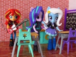 Size: 1600x1200 | Tagged: safe, artist:whatthehell!?, derpibooru import, starlight glimmer, sunset shimmer, trixie, equestria girls, boots, chair, chalkboard, classroom, clothes, desk, doll, equestria girls minis, gem, guitar, irl, jacket, photo, school, shoes, skirt, toy