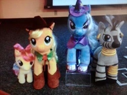 Size: 486x364 | Tagged: safe, derpibooru import, apple bloom, applejack, trixie, zecora, earth pony, pony, zebra, build-a-bear, irl, official, photo, plushie