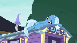 Size: 1280x720 | Tagged: safe, derpibooru import, screencap, trixie, pony, unicorn, road to friendship, cute, diatrixes, female, mare, prone, smiling, solo, trixie's wagon, wagon