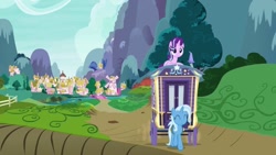 Size: 1280x720 | Tagged: safe, derpibooru import, screencap, starlight glimmer, trixie, pony, unicorn, road to friendship, animation error, duo, duo female, female, mare, ponyville, prone, road, smiling, trixie's wagon, wagon