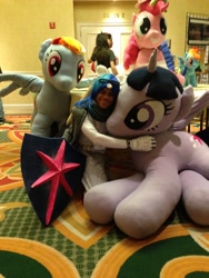 Size: 3264x2448 | Tagged: artist needed, safe, shining armor, twilight sparkle, twilight sparkle (alicorn), alicorn, human, cosplay, hug, irl, irl human, life size, photo, plushie, shield