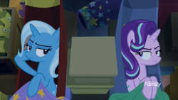 Size: 1920x1080 | Tagged: safe, derpibooru import, screencap, starlight glimmer, trixie, pony, unicorn, road to friendship, annoyed, blanket, cannon, crate, discovery family logo, duo, duo female, eye contact, female, hammock, looking at each other, mare, trixie's wagon