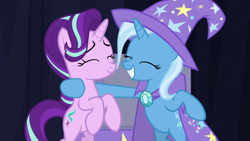 Size: 1280x720 | Tagged: safe, derpibooru import, screencap, starlight glimmer, trixie, pony, unicorn, road to friendship, chest, duo, eyes closed, female, mare, rearing, smiling, stage