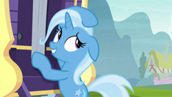 Size: 1280x720 | Tagged: safe, derpibooru import, screencap, trixie, pony, unicorn, road to friendship, bipedal, bipedal leaning, female, floppy ears, leaning, looking back, mare, smiling, solo, trixie's wagon