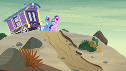 Size: 1280x720 | Tagged: safe, derpibooru import, screencap, starlight glimmer, trixie, pony, unicorn, road to friendship, desert, duo, female, mare, road, singing, trixie's wagon, wagon, we're friendship bound