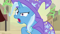 Size: 1280x720 | Tagged: safe, derpibooru import, screencap, trixie, pony, unicorn, road to friendship, cape, clothes, female, hat, mare, open mouth, solo, trixie's cape, trixie's hat