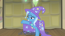 Size: 1280x720 | Tagged: safe, derpibooru import, screencap, trixie, pony, unicorn, road to friendship, cape, clothes, female, hat, lidded eyes, mare, raised hoof, smiling, solo, trixie's cape, trixie's hat, wizard hat