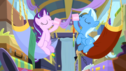 Size: 1600x900 | Tagged: safe, derpibooru import, screencap, starlight glimmer, trixie, pony, unicorn, best gift ever, cup, drinking, duo, eyes closed, female, hammock, hoof hold, mare, teacup, trixie's wagon