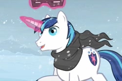 Size: 960x640 | Tagged: safe, screencap, shining armor, pony, unicorn, the crystal empire, clothes, crystal empire, magic, scarf, snow, snow goggles, snowfall, solo, telekinesis