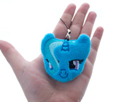 Size: 1230x1000 | Tagged: safe, artist:meplushyou, derpibooru import, trixie, human, pony, unicorn, charm, female, hair over one eye, hand, irl, irl human, lidded eyes, looking at you, mare, photo, plushie, smiling