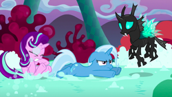 Size: 1440x810 | Tagged: safe, derpibooru import, screencap, starlight glimmer, thorax, trixie, changeling, pony, unicorn, to where and back again, chaos, female, flying, mare, prone, soap, soap roads, suds, trio, trixie is not amused, unamused