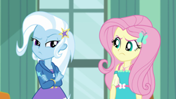 Size: 1920x1080 | Tagged: safe, derpibooru import, screencap, fluttershy, trixie, butterfly, a little birdie told me, better together, equestria girls, angry, annoyed, barrette, canterlot high, classroom, clothes, crossed arms, dress, duo, female, frown, geode of fauna, hairclip, hoodie, looking at each other, madorable, magical geodes, pouting, raised eyebrow, rivalry, skirt, standoff, stars, window