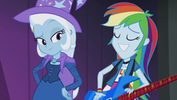 Size: 1920x1080 | Tagged: safe, derpibooru import, screencap, rainbow dash, trixie, equestria girls, rainbow rocks, cape, clothes, female, guitar, hat, trixie's cape, trixie's hat