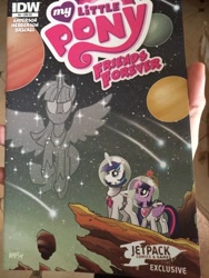 Size: 768x1024 | Tagged: safe, artist:tonyfleecs, idw, shining armor, twilight sparkle, twilight sparkle (alicorn), alicorn, pony, unicorn, cover, female, jetpack, jetpack comics, mare, planet, ponies in space, space, spacesuit