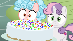 Size: 1600x900 | Tagged: safe, screencap, cozy glow, sweetie belle, pegasus, pony, marks for effort, cake, female, filly, food, sprinkles, sugarcube corner, surprised