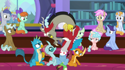 Size: 1280x720 | Tagged: safe, screencap, clever musings, cozy glow, discord, gallus, november rain, ocellus, peppermint goldylinks, slate sentiments, smolder, strawberry scoop, summer meadow, violet twirl, changedling, changeling, draconequus, dragon, griffon, pegasus, pony, a matter of principals, season 8, 30 rock, background pony, baseball cap, bow, cap, dragoness, female, filly, friendship student, hair bow, hat, how do you do fellow kids, male, open mouth, pointing, san diego comic con, school of friendship, sdcc 2018, sitting, steve buscemi, tail bow