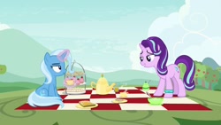 Size: 1920x1080 | Tagged: safe, derpibooru import, screencap, starlight glimmer, trixie, pony, student counsel, bracelet, cup, cupcake, food, jewelry, kettle, magic, picnic blanket, sandwich, teacup, unamused