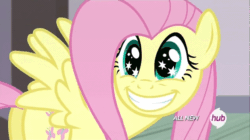 Size: 630x354 | Tagged: safe, derpibooru import, screencap, fluttershy, pegasus, pony, filli vanilli, animated, cute, eye shimmer, faic, grin, hub logo, shyabetes, smiling, solo, spread wings, squee, starry eyes, weapons-grade cute, wingding eyes