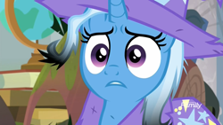 Size: 1920x1080 | Tagged: safe, derpibooru import, screencap, trixie, pony, unicorn, a horse shoe-in, burned, cape, classroom, clothes, discovery family logo, female, frazzled, frown, hat, heartbreak, mare, messy mane, offended, sad, school of friendship, solo, trixie's cape, trixie's hat, wide eyes