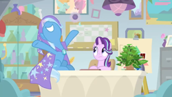 Size: 1600x900 | Tagged: safe, derpibooru import, screencap, phyllis, starlight glimmer, trixie, pony, unicorn, a horse shoe-in, bulletin board, cabinet, cape, ceiling light, clothes, desk, easel, female, file cabinet, flower vase, hat, house plant, mare, office, philodendron, picture frame, poser, smoke bomb, trixie's cape, trixie's hat