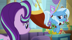 Size: 1920x1080 | Tagged: safe, derpibooru import, screencap, starlight glimmer, trixie, pony, unicorn, a horse shoe-in, book, chest, female, flower, hammock, looking over shoulder, mare, sad, trixie's wagon, vase, wagon, window