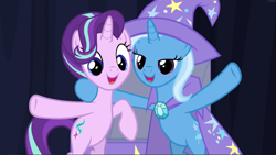 Size: 1667x939 | Tagged: safe, derpibooru import, screencap, starlight glimmer, trixie, pony, unicorn, road to friendship, bipedal, cape, clothes, cropped, cute, duo, female, glimmerbetes, hat, hoof around neck, lidded eyes, mare, open mouth, smiling, trixie's cape, trixie's hat, waving