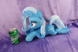 Size: 5472x3648 | Tagged: safe, artist:kazzysart, derpibooru import, trixie, pony, unicorn, female, irl, lidded eyes, mare, photo, plushie, prone, soda can, solo, sprite (drink)