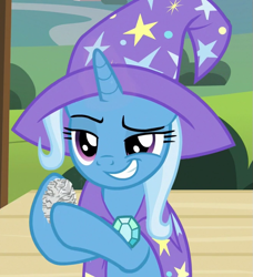 Size: 657x720 | Tagged: safe, derpibooru import, screencap, trixie, pony, unicorn, uncommon bond, cape, clothes, cropped, female, hat, holding, mare, raised eyebrow, raised hoof, solo, trixie's cape, trixie's hat