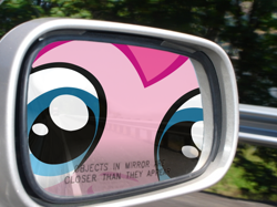 Size: 590x442 | Tagged: safe, artist:necronomiconofgod, artist:ponyweed, edit, part of a set, pinkie pie, automobile, car, close up series, close-up, extreme close up, fourth wall, fourth wall destruction, irl, mirror, objects in mirror are closer than they appear, parody, photo, rear view mirror, the far side