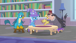 Size: 1920x1080 | Tagged: safe, derpibooru import, screencap, gallus, grampa gruff, trixie, griffon, pony, unicorn, a horse shoe-in, blind eye, book, bookshelf, cape, clothes, eye scar, female, fez, hat, lamp, mare, pillow, scar, sitting, stool, table, trixie's cape, trixie's hat, window