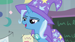 Size: 1920x1080 | Tagged: safe, derpibooru import, screencap, trixie, pony, unicorn, a horse shoe-in, cape, clothes, female, hat, mare, solo, trixie's cape, trixie's hat