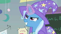 Size: 1920x1080 | Tagged: safe, derpibooru import, screencap, trixie, pony, unicorn, a horse shoe-in, cape, clothes, female, grin, hat, magic, magic aura, mare, smiling, solo, trixie's cape, trixie's hat