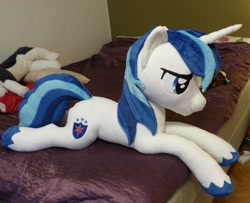 Size: 3483x2835 | Tagged: safe, artist:epicrainbowcrafts, shining armor, pony, unicorn, bed, irl, life size, photo, plushie, prone, solo