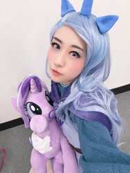 Size: 1202x1600 | Tagged: safe, artist:bunnyoxo, derpibooru import, starlight glimmer, trixie, human, cape, clothes, convention:japanponycon, cosplay, costume, crown, horn, irl, irl human, japan ponycon, jewelry, photo, plushie, pony ears, regalia, trixie's cape