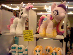 Size: 640x480 | Tagged: safe, princess cadance, sweetie belle, alicorn, pony, booth, botcon, convention, plushie, tailgate, transformers