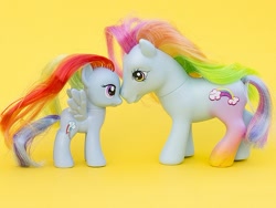 Size: 500x375 | Tagged: safe, rainbow dash, rainbow dash (g3), g3, g4, nuzzling, toy