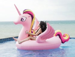 Size: 1200x928 | Tagged: safe, princess cadance, alicorn, human, inflatable pony, barefoot, bootleg, clothes, feet, floating, inflatable, inflatable toy, irl, irl human, let's fly to equestria, photo, pool toy, riding, swimming pool, swimsuit, water