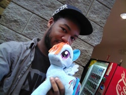 Size: 800x600 | Tagged: safe, rainbow dash, human, baseball cap, funrise, hat, irl, irl human, official, photo, plushie, vending machine