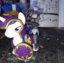 Size: 2160x2114 | Tagged: safe, artist:omegapony16, shining armor, human, guardians of harmony, gun, helmet, irl, male, misadventures of the guardians, photo, riding, shield, soldier, stallion, toy, weapon