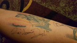 Size: 5312x2988 | Tagged: safe, derpibooru import, rainbow dash, human, ashleigh ball, irl, irl human, photo, signature, tattoo