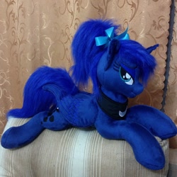 Size: 960x960 | Tagged: safe, artist:burgunzik, princess luna, alicorn, pony, :t, alternate hairstyle, bedroom eyes, bow, female, hair bow, irl, looking at you, mare, missing accessory, photo, plushie, ponytail, prone, smiling, solo