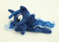 Size: 1000x716 | Tagged: safe, artist:yukamina-plushies, princess luna, alicorn, pony, beanie (plushie), female, horn, irl, mare, missing accessory, photo, plushie, prone, solo, spread wings, wings