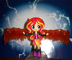 Size: 1032x850 | Tagged: safe, sunset shimmer, equestria girls, boots, clothes, doll, equestria girls minis, fiery wings, irl, jacket, leather jacket, photo, skirt, solo, sunset phoenix, toy