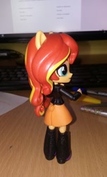Size: 768x1262 | Tagged: safe, artist:artofmagicpoland, derpibooru exclusive, sunset shimmer, equestria girls, boots, clothes, doll, equestria girls minis, jacket, leather jacket, looking at you, phone, pinup, sexy, shoes, skirt, sultry pose, toy