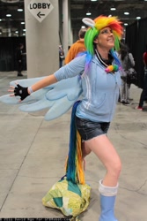 Size: 683x1024 | Tagged: artist needed, safe, rainbow dash, human, clothes, comikaze expo, comikaze expo 2011, cosplay, fingerless gloves, gloves, irl, irl human, photo, solo, wings