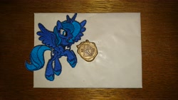 Size: 5984x3366 | Tagged: safe, artist:bastler, artist:moon flower, artist:talocan212, derpibooru exclusive, princess luna, alicorn, pony, seal, 2019, envelope, female, irl, logo, mare, patch, photo, solo, wax, wax seal