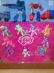 Size: 1344x1792 | Tagged: safe, derpibooru import, coco pommel, fluttershy, pinkie pie, rainbow dash, rarity, starlight glimmer, suri polomare, twilight sparkle, twilight sparkle (alicorn), alicorn, pegasus, pony, unicorn, clash of hasbro's titans, female, mare, mcdonald's happy meal toys, op is a slowpoke, optimus prime, thunderhoof, toy, transformers, transformers robots in disguise (2015)