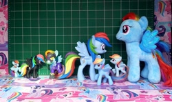 Size: 1000x591 | Tagged: safe, rainbow dash, beanie babies, blind bag, clothes, costume, funko, irl, mcdonald's happy meal toys, mystery minis, photo, plushie, rearing, shadowbolt dash, shadowbolts, shadowbolts costume, size comparison, toy